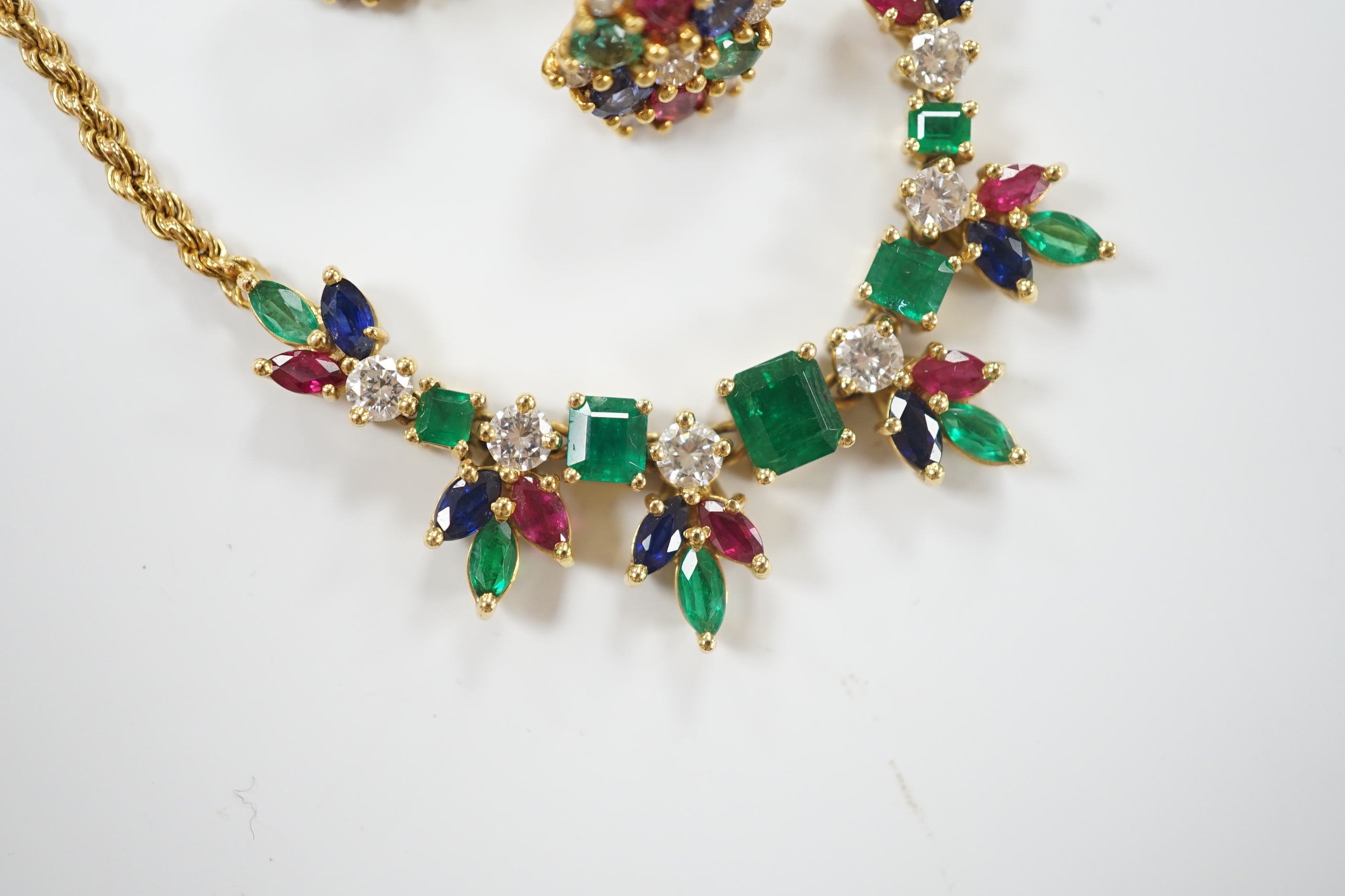 A 1960's? yellow metal, ruby, sapphire, emerald and diamond cluster set 'tutti fruiti' necklace, 44cm and pair of matching ear studs, the butterflies stamped 750